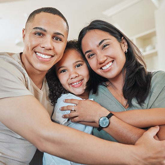 Happy family outside a Tucson home