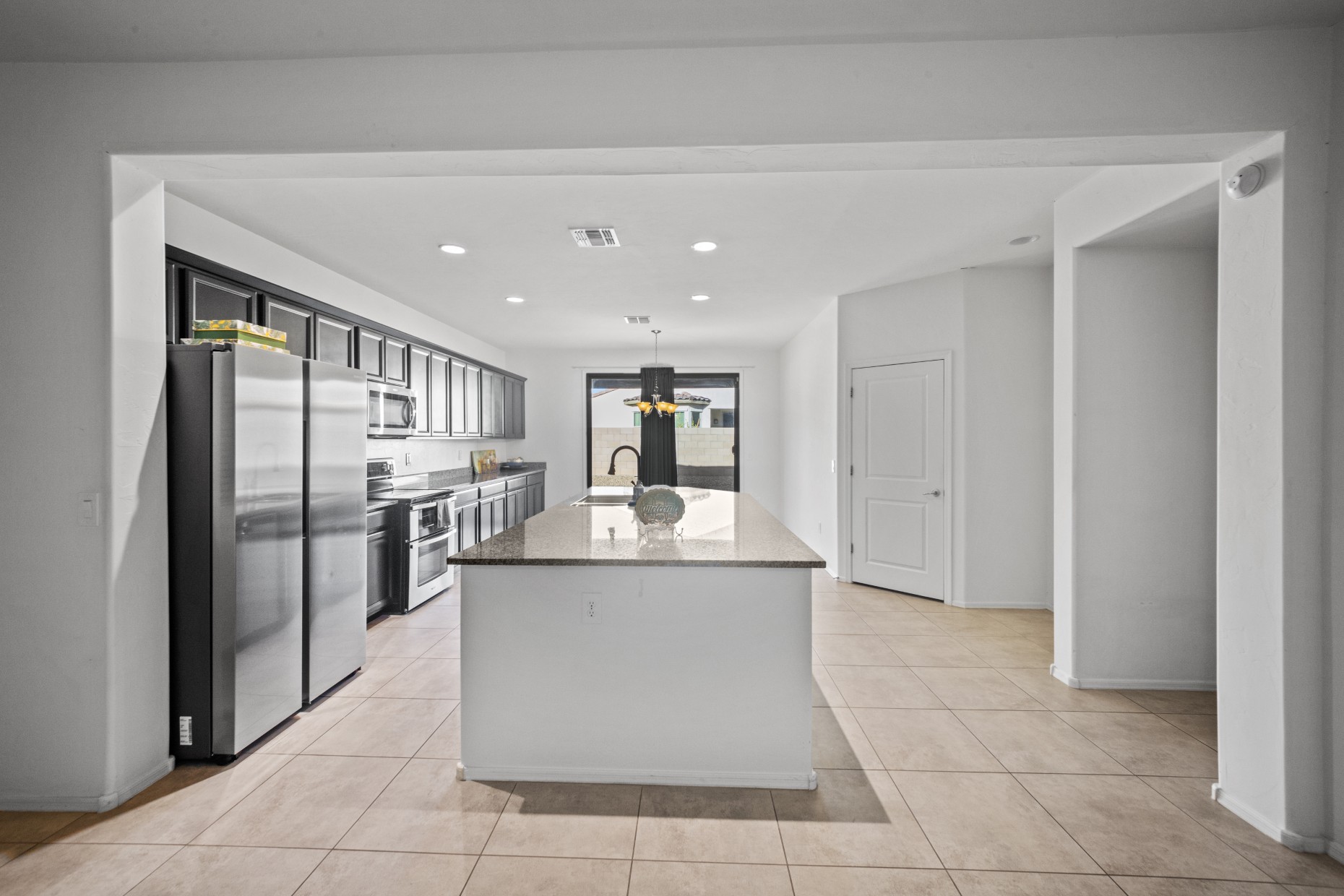 Kitchen with island and stainless appliances