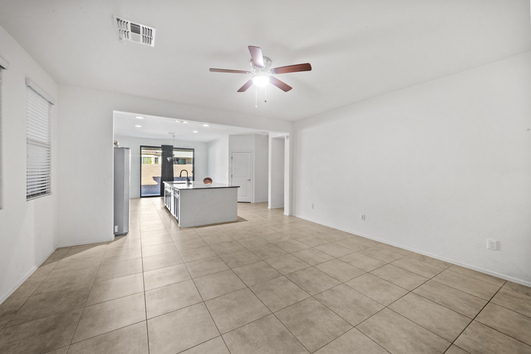 Open living room with ceiling fan