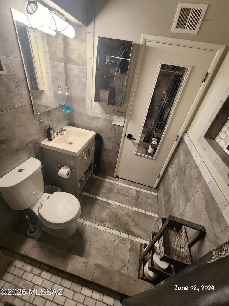 Bathroom vanity and toilet