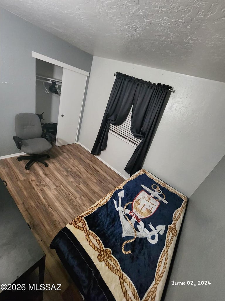 Bedroom with closet and desk area