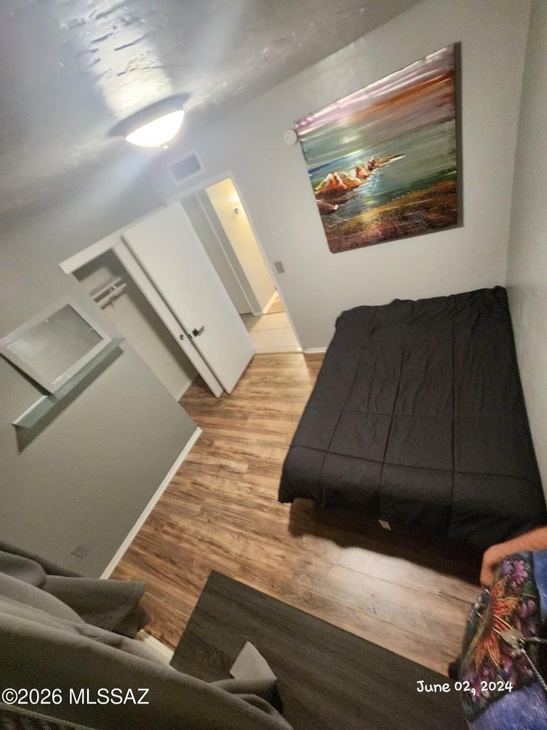 Bedroom with wood-look flooring
