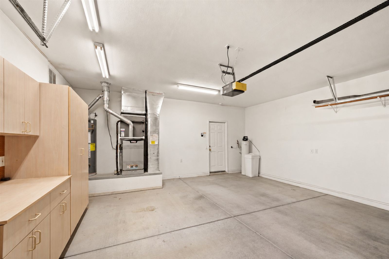 Two-car garage with built-in cabinets