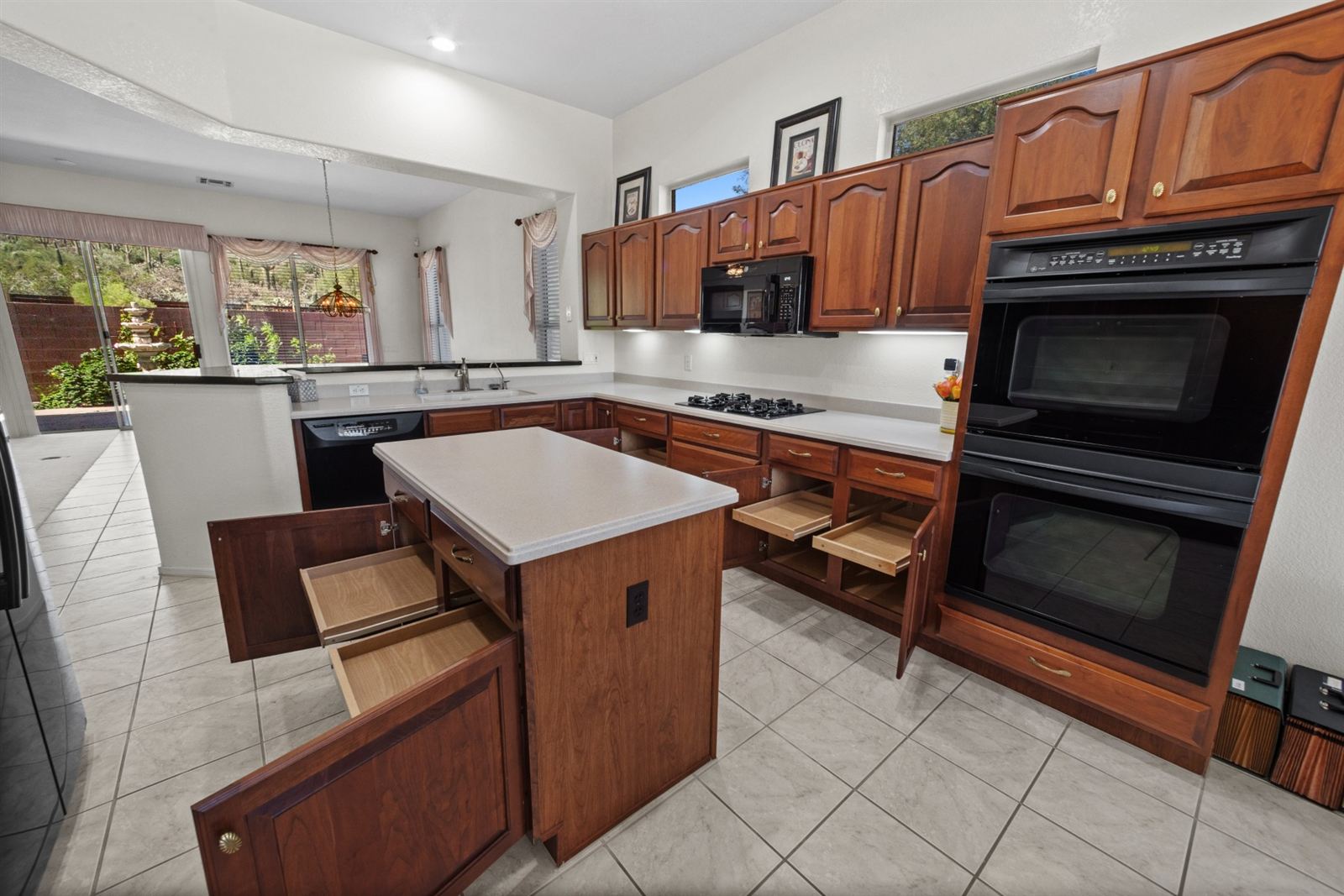 Kitchen with double ovens and pull-out shelving