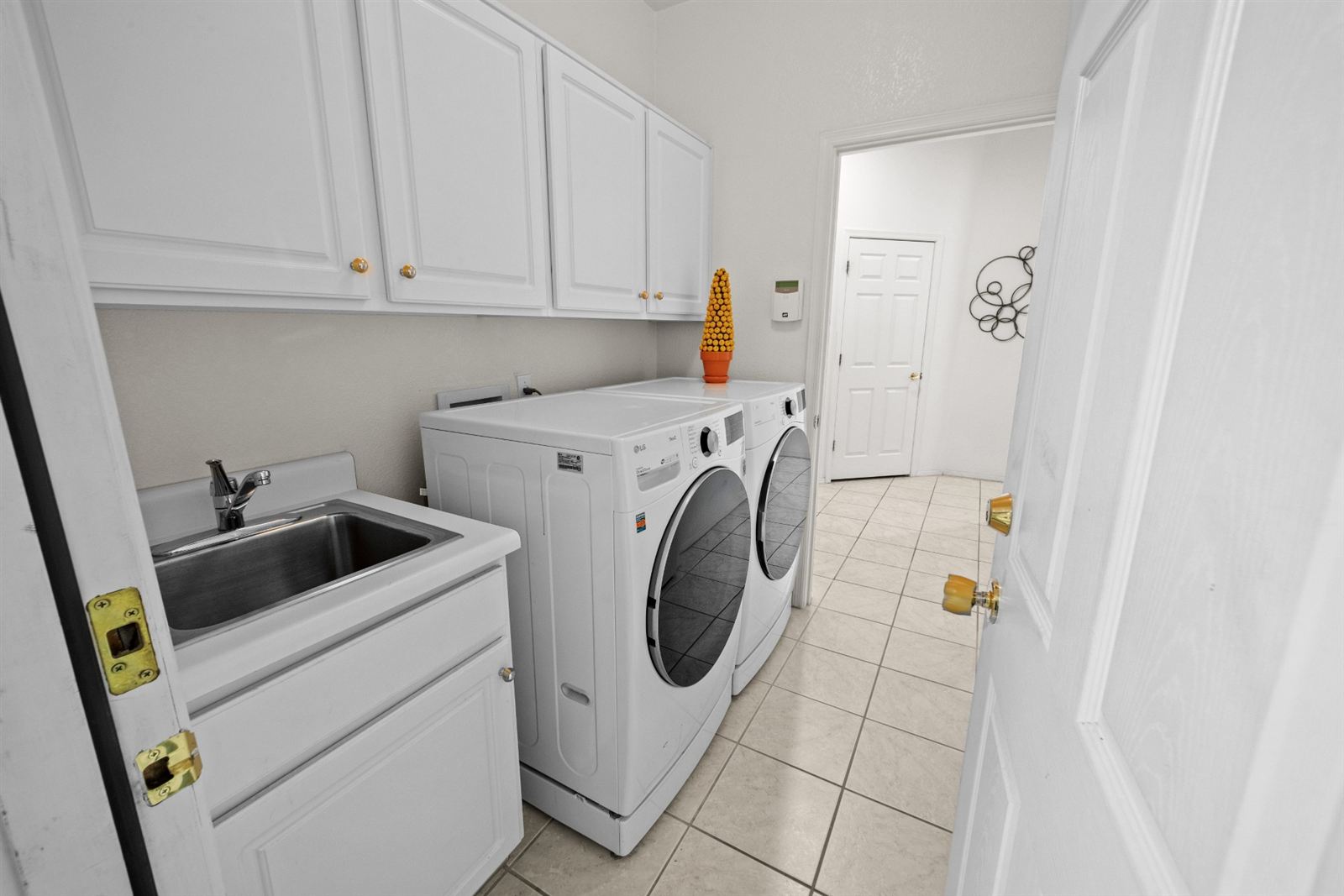 Laundry room with washer, dryer and utility sink